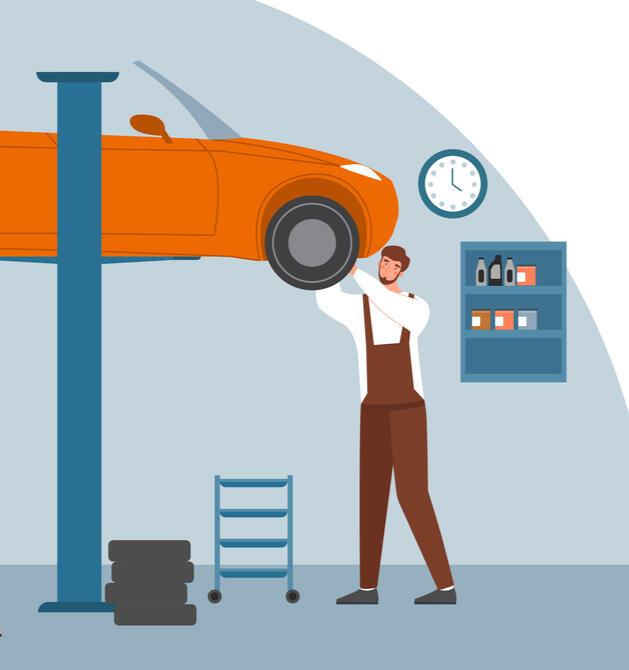 Mechanic at work at an auto shop with a shelf of inventory behind him